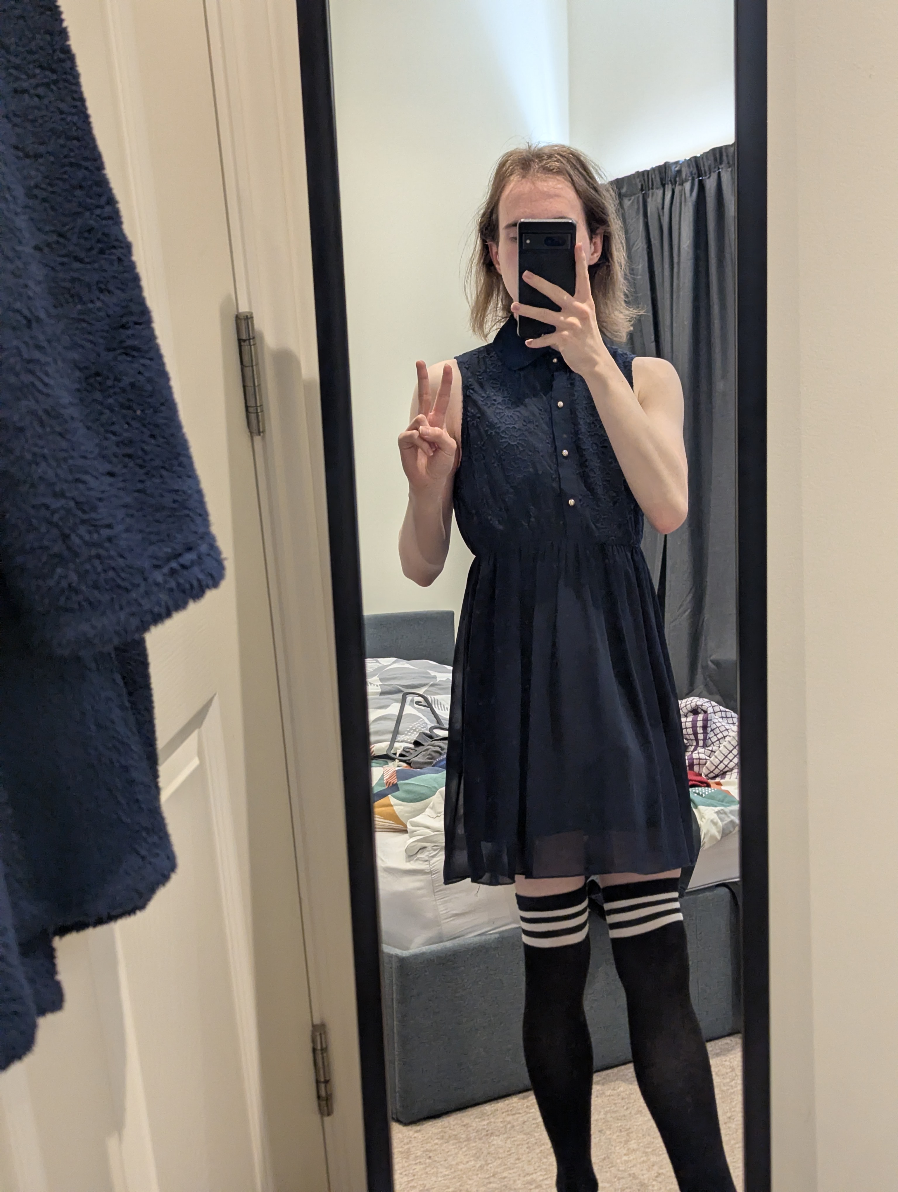 a mirror selfie of me wearing a blue dress and thigh highs